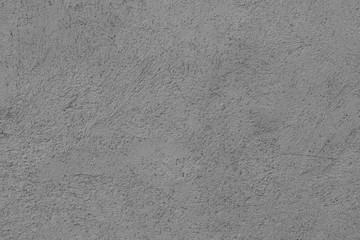 Old cement porous wall made of gray cement with bumps. Abstract colorless background for design and title. Perfectly selects an object