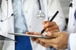 © H_Ko - Female GP making electronic notes in tablet pc closeup
