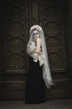 Calavera Catrina In The Dark. Fashion Model With Sugar Skull Makeup. Dia De Los Muertos. Day Of The Dead. Halloween.