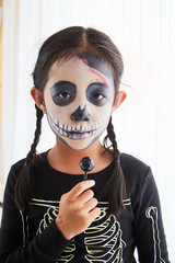 Wall Mural - Little girl in halloween costume at home