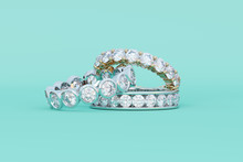 Three Diamond Eternity Rings On Turquoise Background