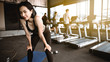 © thitipong - Asian woman exercise in gym. Sport woman relaxing. exercise in gym concept.