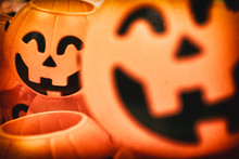 A Blurry Jack O'lantern Or Halloween Pumpkins With Antique Old Film Camera Effect