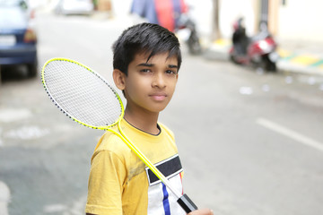 Wall Mural - Indian Young teen boy playing badminton