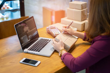 Shipping Shopping Online ,young Start Up Small Business Owner Writing Address On Cardboard Box At Workplace.small Business Entrepreneur SME Or Freelance Asian Woman Working With Box At Home