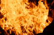 © atevi - Open fire, flames absorb everything that gets in the way. On the street night, background of orange flame.