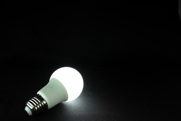 Light bulb on black background