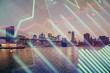 © peshkova - Financial graph on night city scape with tall buildings background multi exposure. Analysis concept.