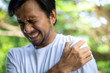 © anut21ng Stock - young asian man with pain in shoulder , health care concept