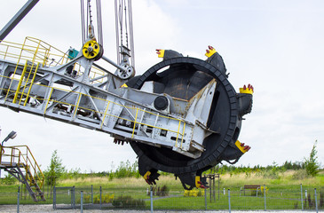 Opencast brown coal mine. Excavator SchRs-315. Extractive industry.