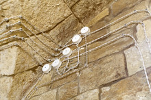 Electrical Wiring On The Wall Of Old Fortress