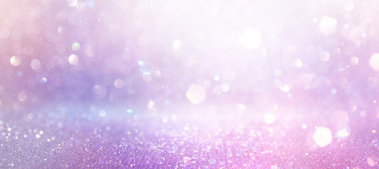 Wall Mural - abstract glitter pink, purple and gold lights background. de-focused. banner