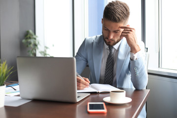 Sticker - Modern businessman thinking about something while sitting in the office