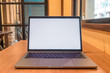 © yaophotograph - Conceptual workspace, Laptop computer with blank white screen on table, blurred background. use in Traditional Chinese Alphabet operating system.