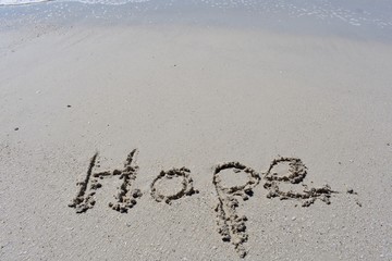 background with hope written in the sand