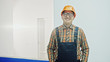© procinemastock - Male construction worker at a building site smiling