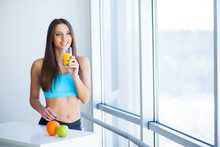 Diet. Happy Smiling Young Woman Drinking Orange Juice