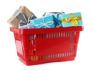 Red shopping basket with different gifts on white background