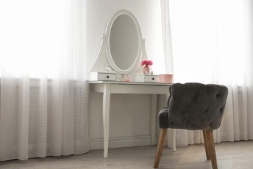 Poster - Elegant white dressing table and armchair in light room