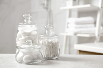 Wall Mural - Cotton balls, swabs and pads on light grey table in bathroom