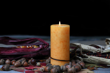 Sticker - Burning candle for Thanksgiving or Halloween holidays with dark background setting