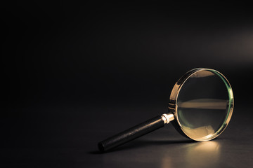 magnifying glass on black