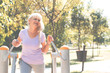 © focusandblur - Senior woman exercising in park