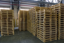 Empty Wooden Pallets In The Warehouse.