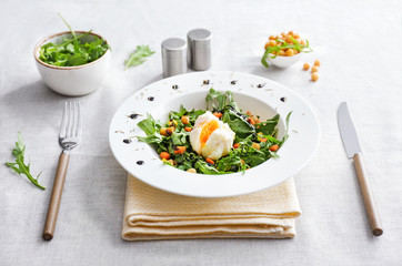 Plate with tasty salad on table