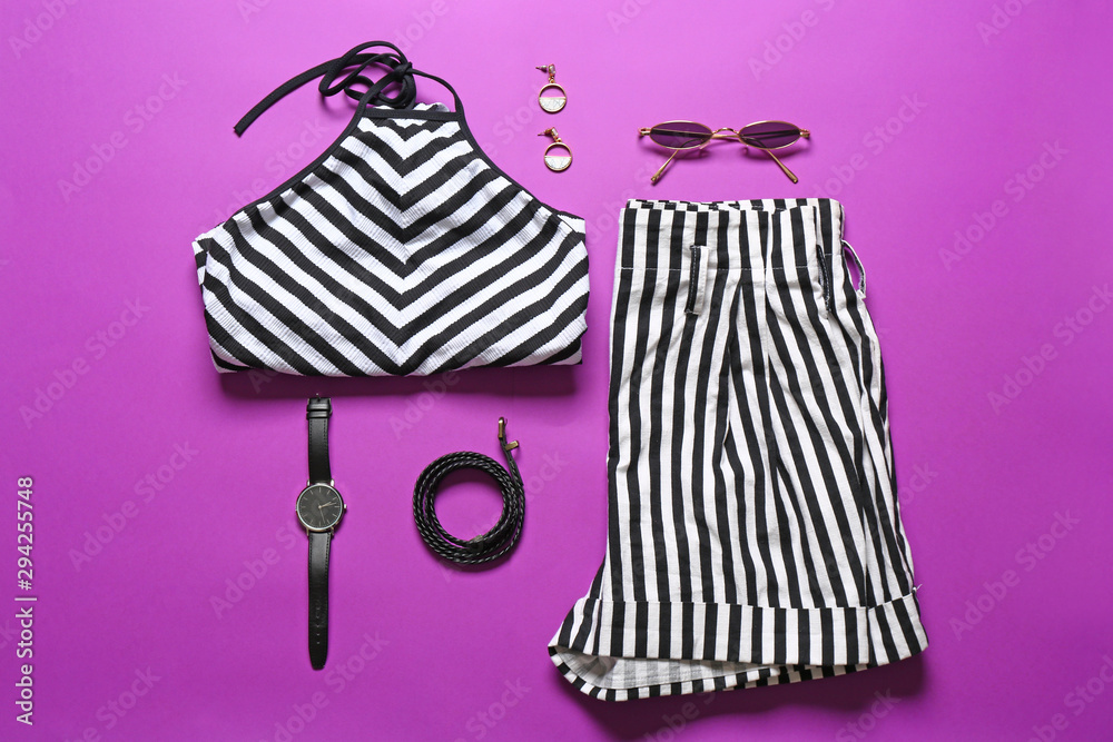 Modern female look with stylish accessories on color background