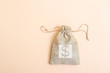 © Augustas Cetkauskas - Money bag on light beige natural background