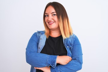 Young beautiful woman wearing denim shirt standing over isolated white background happy face smiling with crossed arms looking at the camera. Positive person.