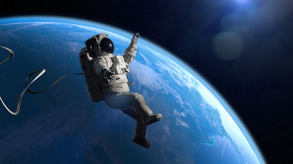 Wall Mural - astronaut in orbit of planet earth