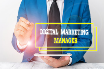 Conceptual hand writing showing Digital Marketing Manager. Concept meaning optimized for posting in online boards or careers Businessman pointing with pen in empty copy space