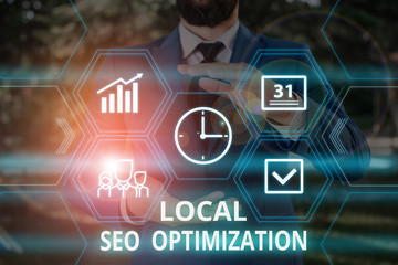 Poster - Word writing text Local Seo Optimization. Business photo showcasing increase Search Visibility to Rank on Top list Male human wear formal work suit presenting presentation using smart device