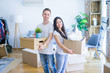 © Krakenimages.com - Young beautiful couple moving cardboard boxes at new home