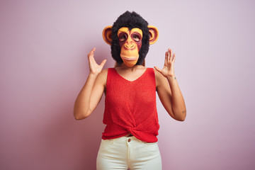 Poster - Woman standing wearing t-shirt and monkey mask