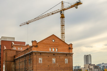 Renovation of the old 19th century house next to the new houses.