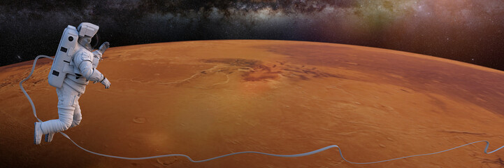 Wall Mural - astronaut performing a space walk in orbit of planet mars