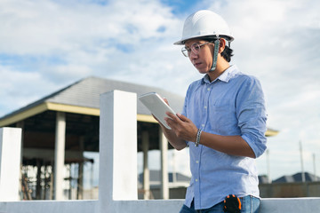 Wall Mural - Male architect inspecting building house construction  worker at development site