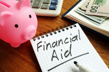 Wall Mural - Financial aid sign with money and piggy bank.