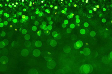 Green shiny glitters background. Green abstract texture.