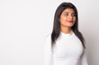 © Ranta Images - Portrait of young beautiful Persian woman thinking
