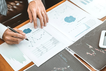 Wall Mural - Business Team Investment Entrepreneur Trading discussing and analysis graph stock market trading,stock chart concept