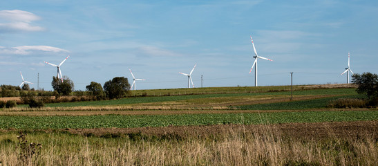 wind turbines farm, power generating windmills, Wind turbines on green hills