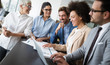 © NDABCREATIVITY - Business colleagues having meeting in conference room in office