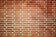 Old vintage brick wall as background in red color.