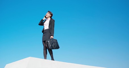 Wall Mural - Asian businesswoman speak on phone