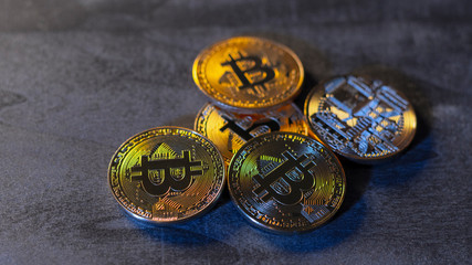 bitcoin coins on a wooden surface