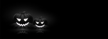 Spooky, Illuminated Jack-o-lanterns On Black Background With Space For Your Text. Website Header Design For Halloween Celebration.